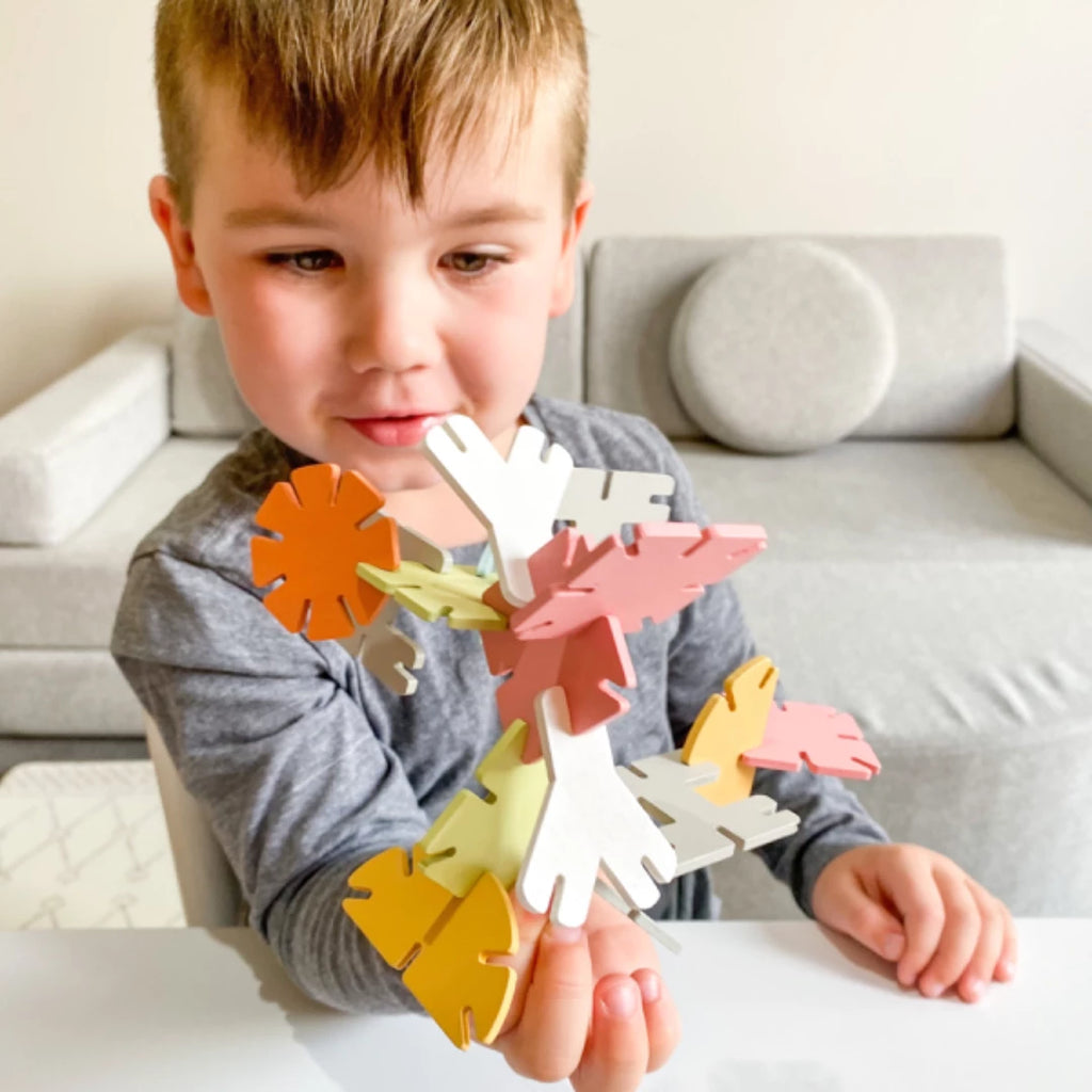 child playing with a 3d puzzle 