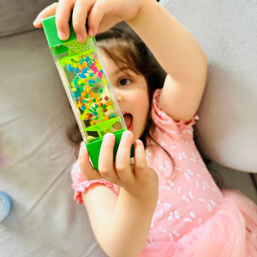 a young girl with a pop it fidget toy 