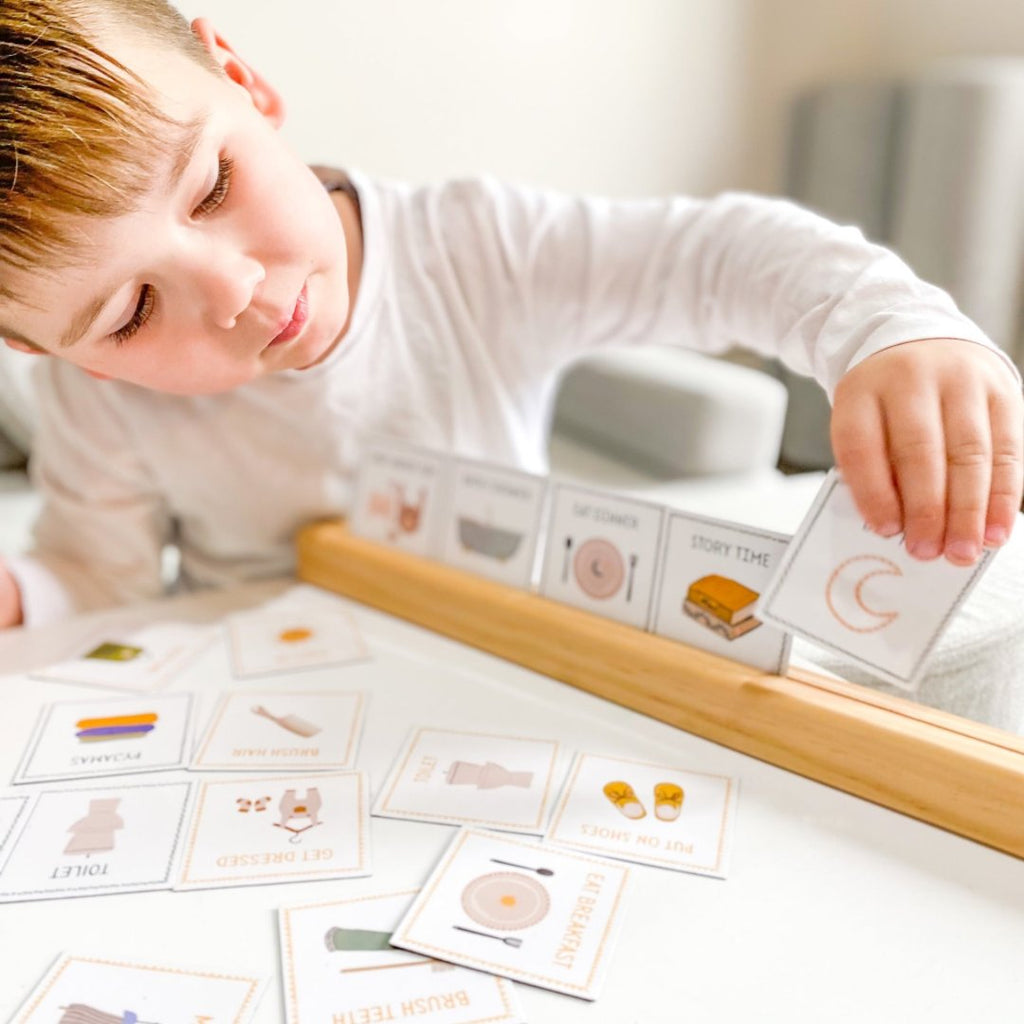 child with routine cards